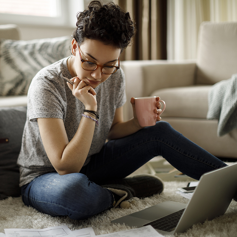 woman with laptop and cup